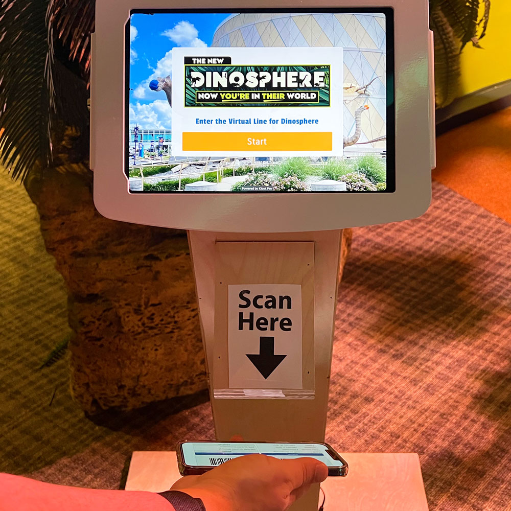 Digital queueing kiosk at the entrance to Dinosphere.